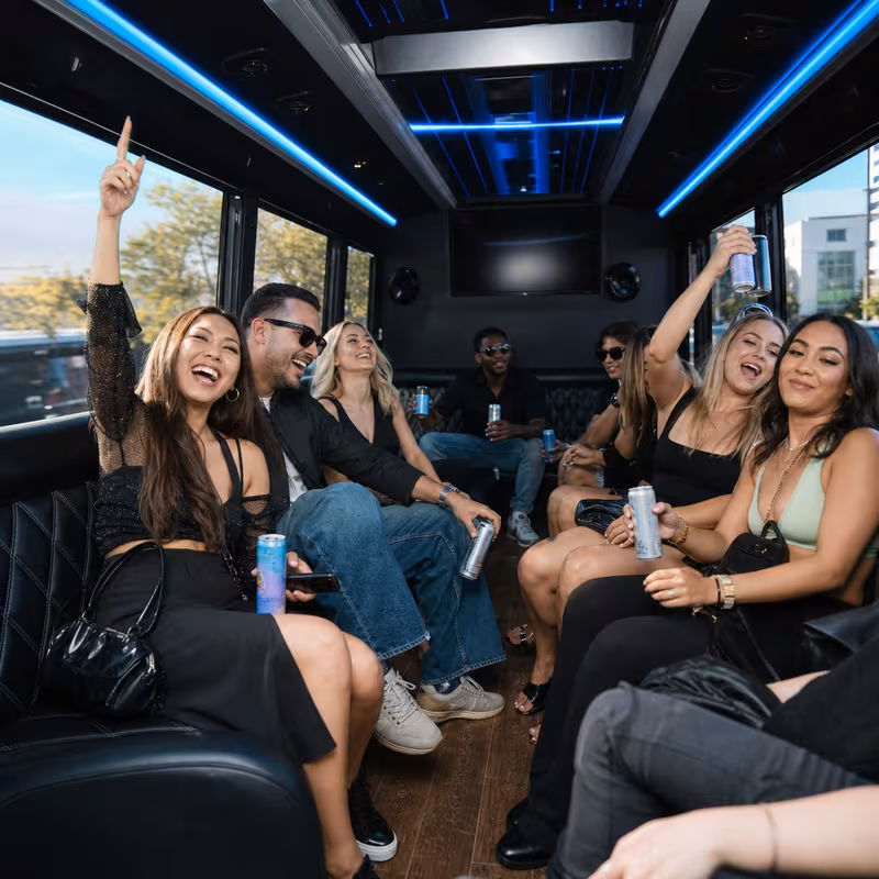 Passengers loading luggage while boarding an Salinas group shuttle