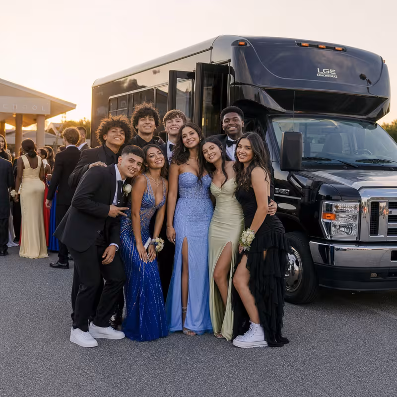 Group boarding a white charter bus for Prom & Homecoming Transportation transportation in Salinas
