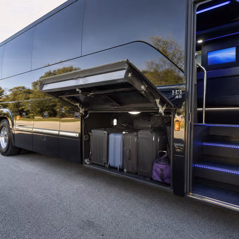 Party bus interior with wraparound leather seating and LED lighting in Salinas