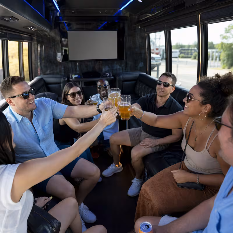 Group boarding a white charter bus for Winery & Brewery Tour Transportation transportation in Salinas
